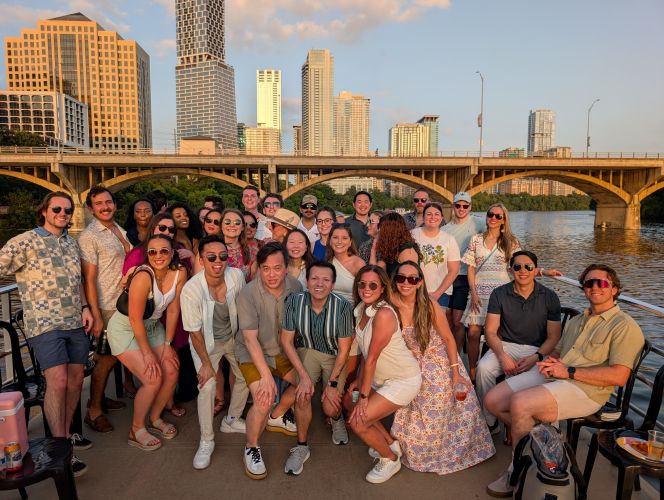 Pharmacy residents standing outside with the city skyline behind them