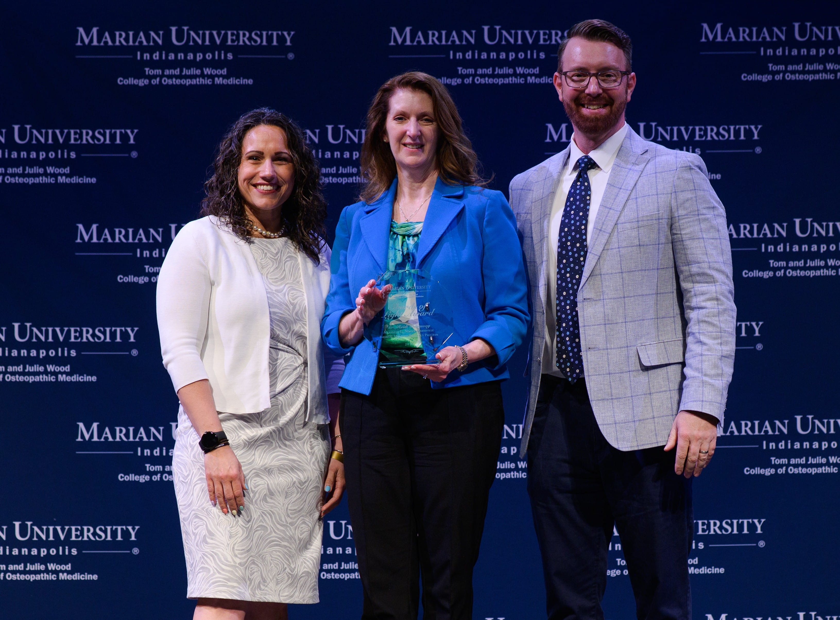 Dr.  Dunniway winning Shards of Light 2025 Award via Marian University
