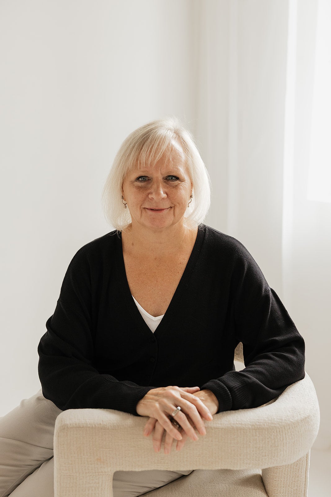 Photograph of a person sitting in a chair